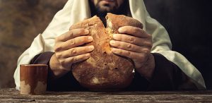 The Last Supper Jesus breaks the bread.